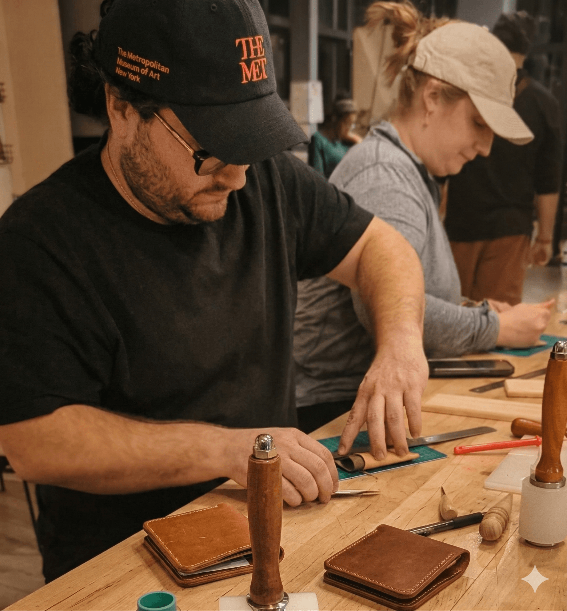 Couple working on leather pieces during an anniversary experience